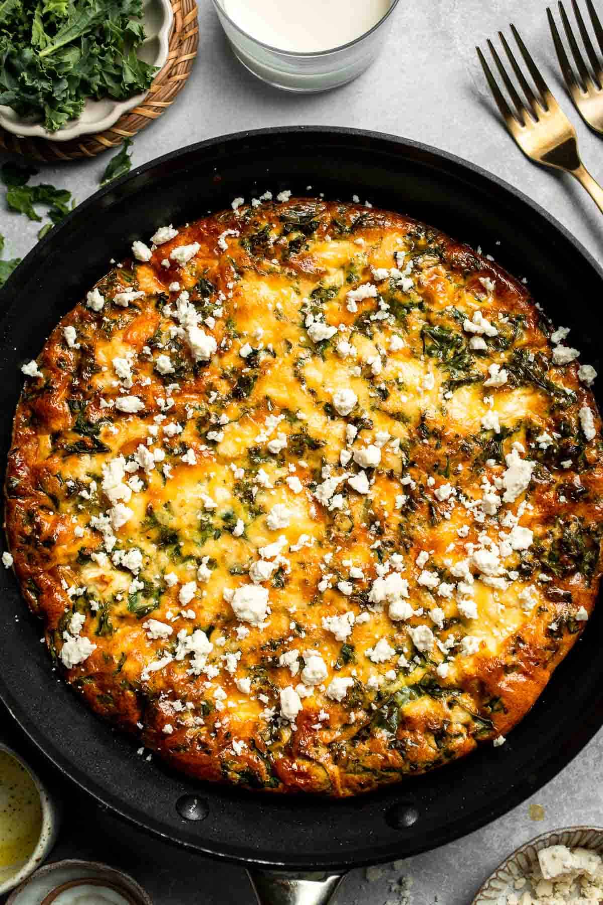 Kale and Sweet Potato Frittata is a protein-packed, one-pan meal with nutrient-dense kale, sweet potatoes, and creamy feta in a fluffy egg base. | aheadofthyme.com