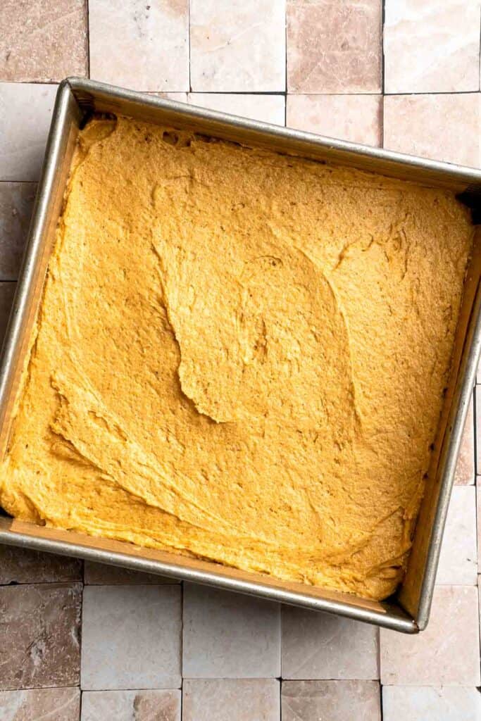 Pumpkin Coffee Cake, topped with a sweet and crunchy streusel and a maple glaze drizzle, is soft, moist, and filled with warm fall spices. | aheadofthyme.com