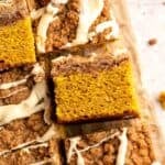 Pumpkin Coffee Cake, topped with a sweet and crunchy streusel and a maple glaze drizzle, is soft, moist, and filled with warm fall spices. | aheadofthyme.com