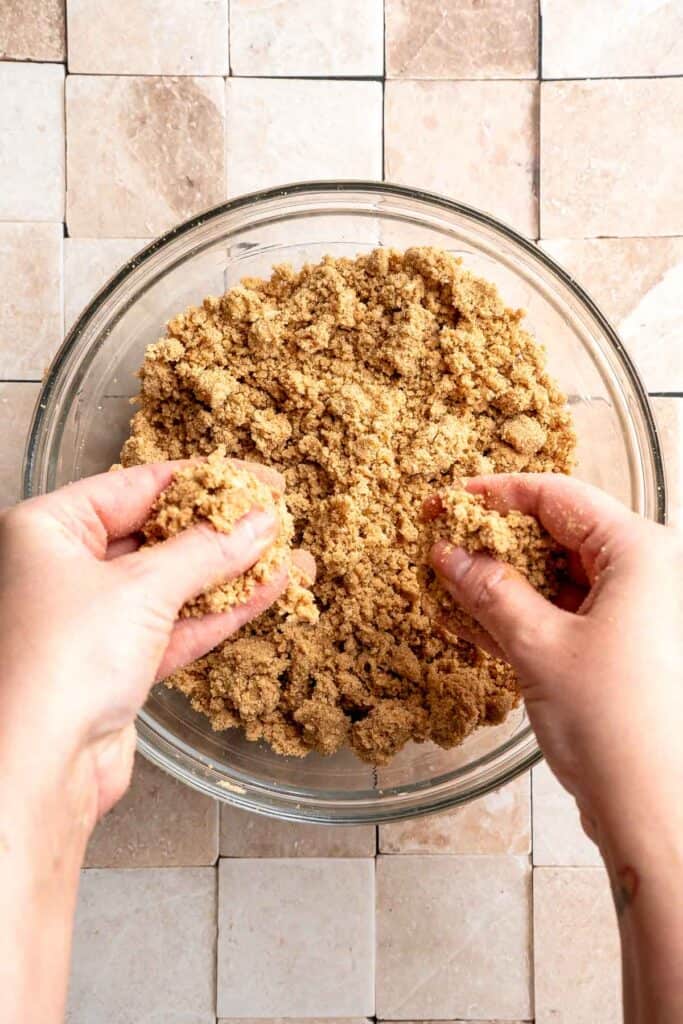 Pumpkin Coffee Cake, topped with a sweet and crunchy streusel and a maple glaze drizzle, is soft, moist, and filled with warm fall spices. | aheadofthyme.com