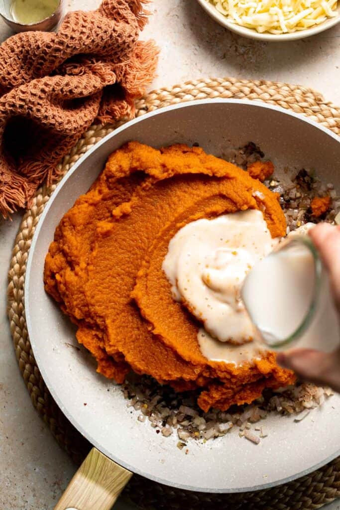 Pumpkin Lasagna with ricotta cheese and spinach is a delicious twist on traditional lasagna - the perfect cozy comfort food for fall. | aheadofthyme.com