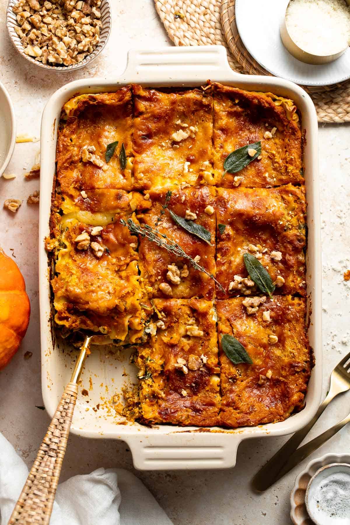 Pumpkin Lasagna with ricotta cheese and spinach is a delicious twist on traditional lasagna — the perfect cozy comfort food for fall. | aheadofthyme.com