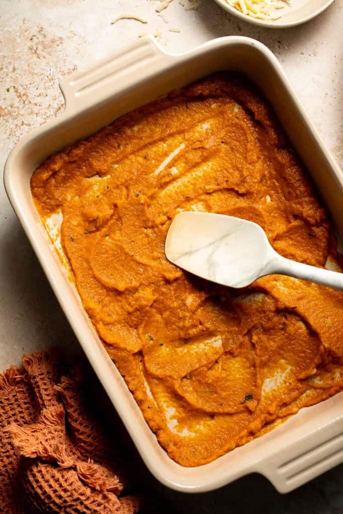 Pumpkin Lasagna with ricotta cheese and spinach is a delicious twist on traditional lasagna - the perfect cozy comfort food for fall. | aheadofthyme.com