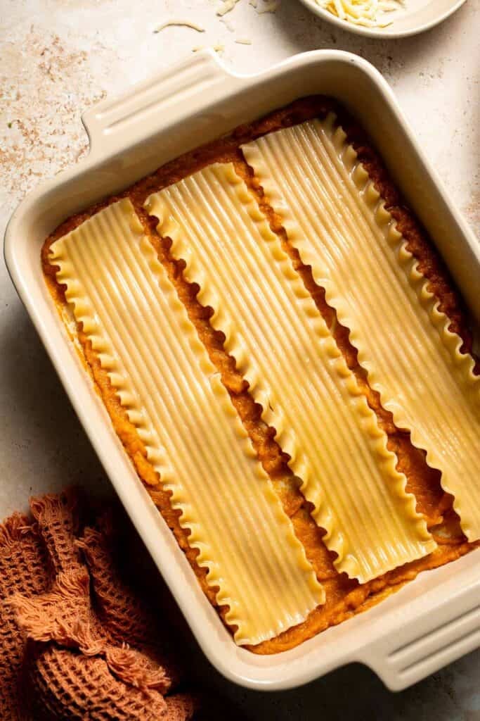 Pumpkin Lasagna with ricotta cheese and spinach is a delicious twist on traditional lasagna - the perfect cozy comfort food for fall. | aheadofthyme.com