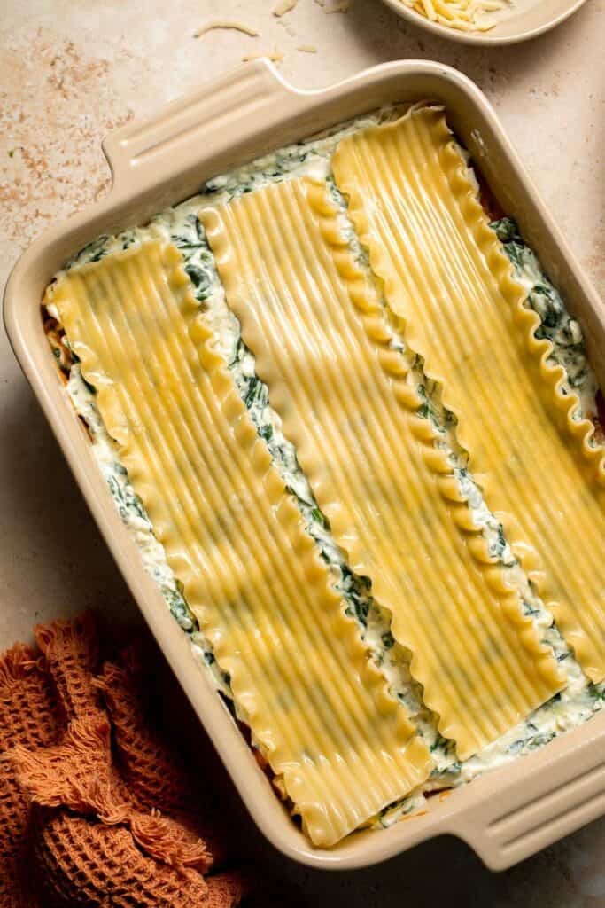 Pumpkin Lasagna with ricotta cheese and spinach is a delicious twist on traditional lasagna - the perfect cozy comfort food for fall. | aheadofthyme.com