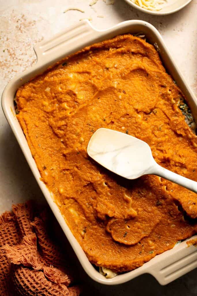 Pumpkin Lasagna with ricotta cheese and spinach is a delicious twist on traditional lasagna - the perfect cozy comfort food for fall. | aheadofthyme.com