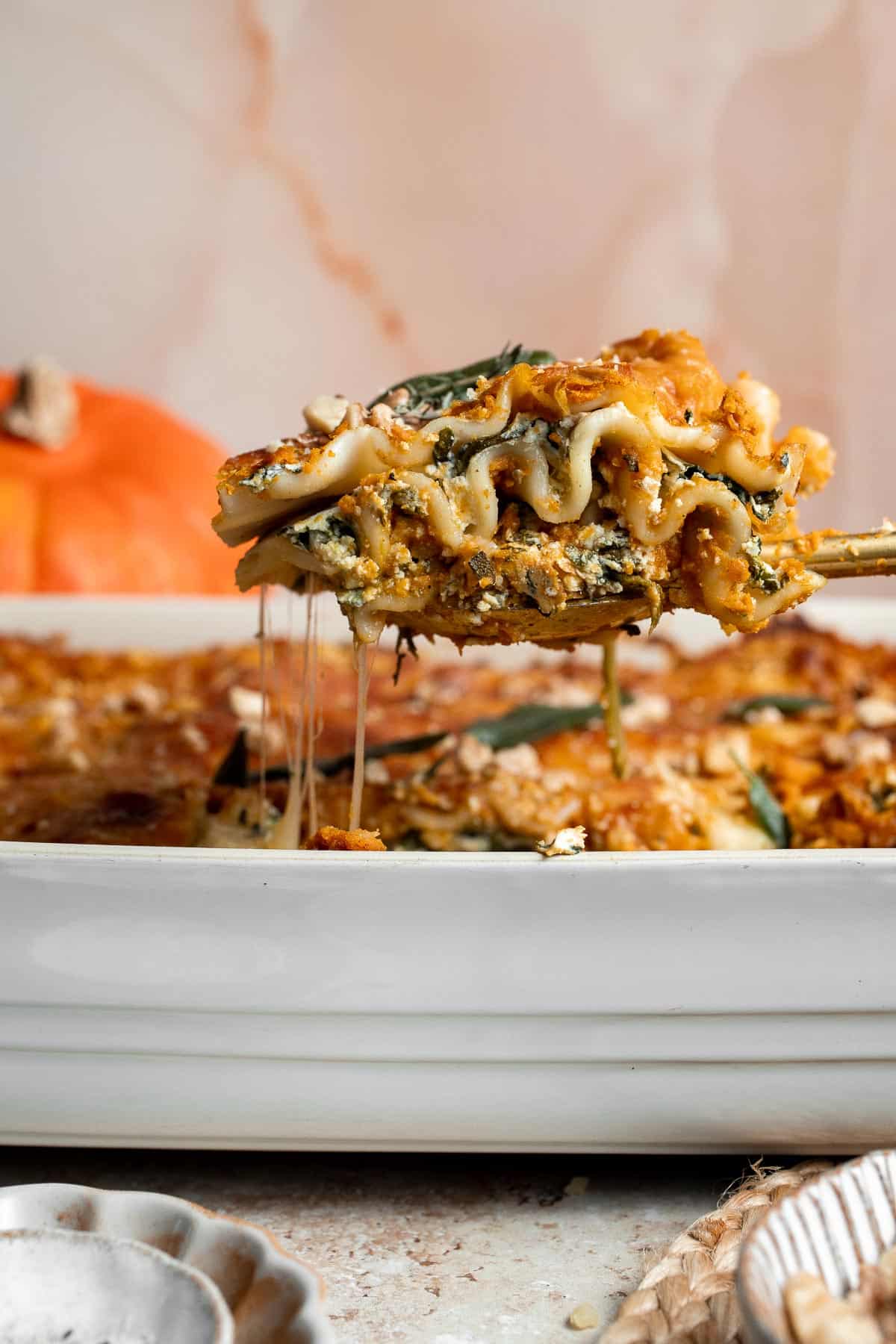 Pumpkin Lasagna with ricotta cheese and spinach is a delicious twist on traditional lasagna — the perfect cozy comfort food for fall. | aheadofthyme.com