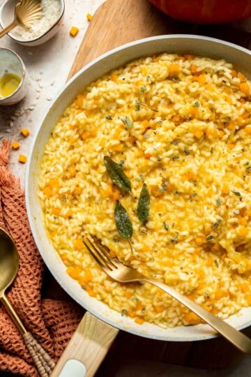 Enjoy a taste of fall with this creamy pumpkin risotto made with arborio rice, savory pumpkin, and aromatic herbs for a cozy, flavorful dish. | aheadofthyme.com