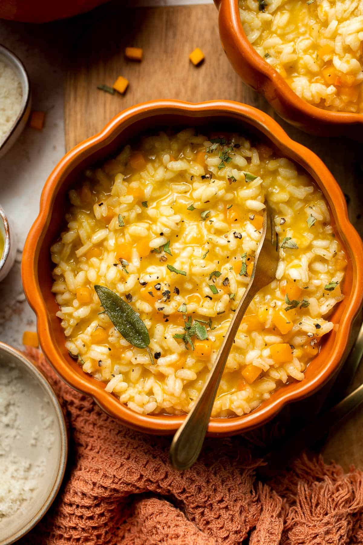 Enjoy a taste of fall with this creamy pumpkin risotto made with arborio rice, savory pumpkin, and aromatic herbs for a cozy, flavorful dish. | aheadofthyme.com