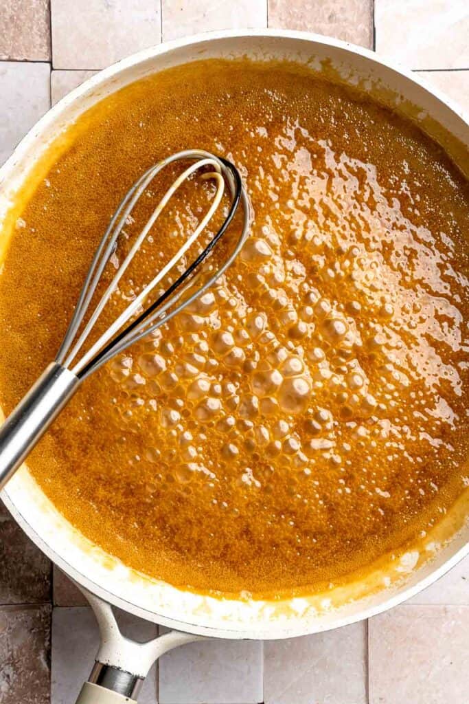 Indulge in a classic British dessert with this sticky toffee pudding recipe made with dates and topped with rich toffee sauce. Moist, sweet, and decadent! | aheadofthyme.com