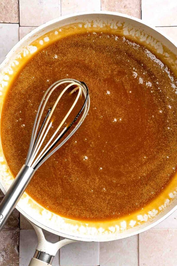 Indulge in a classic British dessert with this sticky toffee pudding recipe made with dates and topped with rich toffee sauce. Moist, sweet, and decadent! | aheadofthyme.com