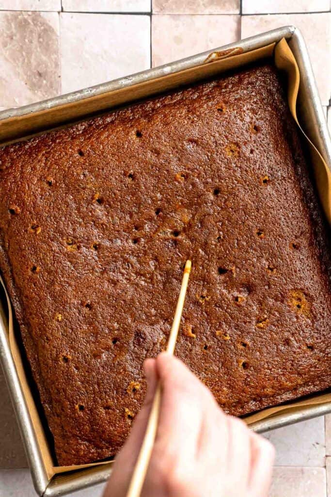 Indulge in a classic British dessert with this sticky toffee pudding recipe made with dates and topped with rich toffee sauce. Moist, sweet, and decadent! | aheadofthyme.com