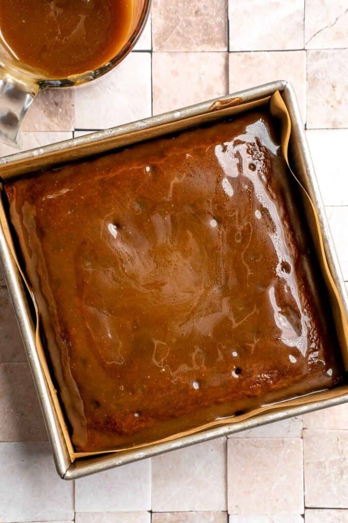 Indulge in a classic British dessert with this sticky toffee pudding recipe made with dates and topped with rich toffee sauce. Moist, sweet, and decadent! | aheadofthyme.com