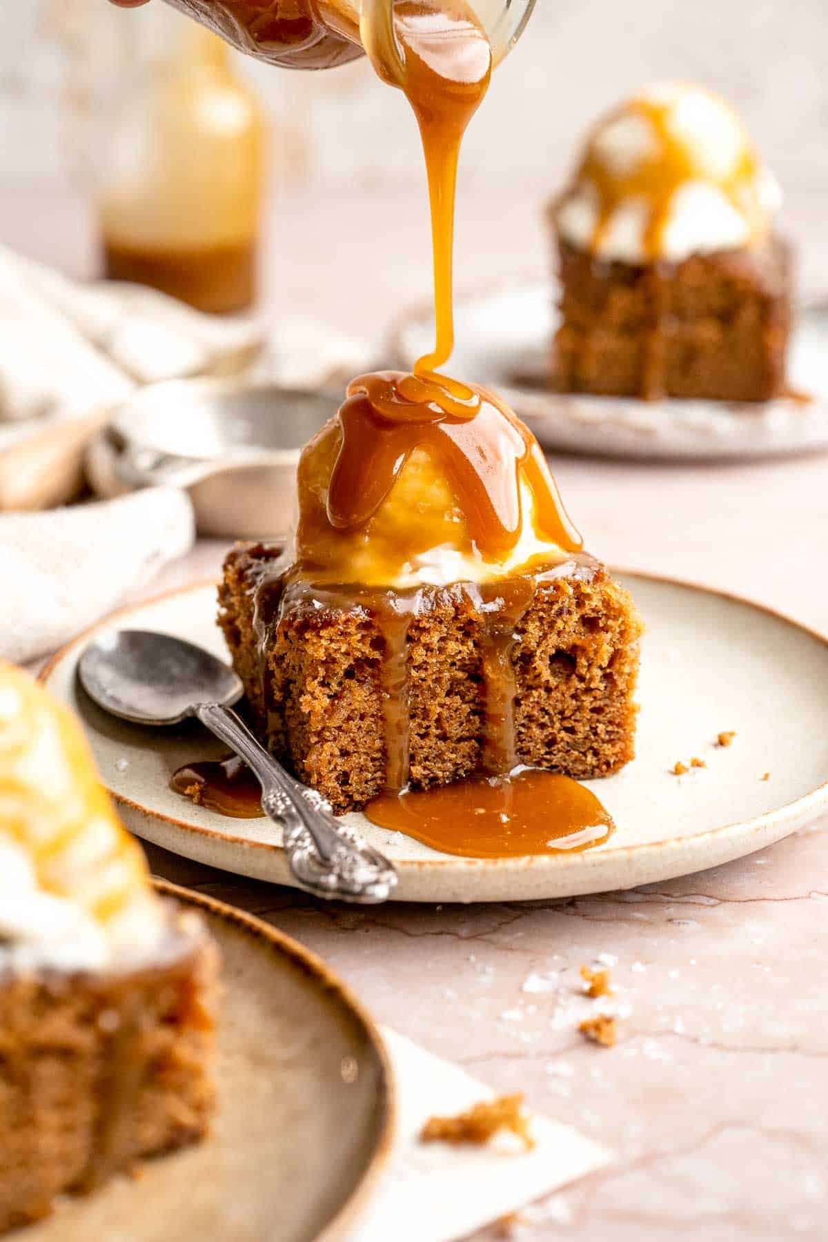 Indulge in a classic British dessert with this sticky toffee pudding recipe made with dates and topped with rich toffee sauce. Moist, sweet, and decadent! | aheadofthyme.com