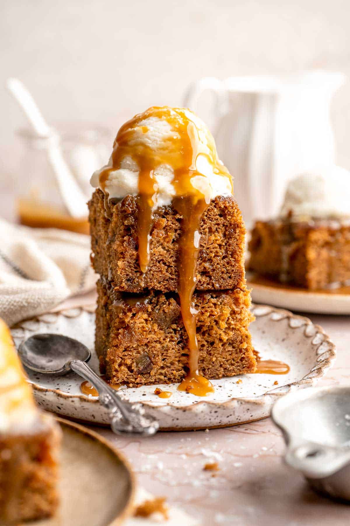 Indulge in a classic British dessert with this sticky toffee pudding recipe made with dates and topped with rich toffee sauce. Moist, sweet, and decadent! | aheadofthyme.com