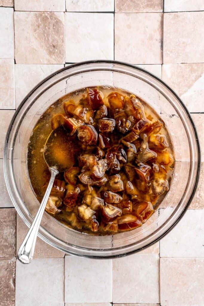 Indulge in a classic British dessert with this sticky toffee pudding recipe made with dates and topped with rich toffee sauce. Moist, sweet, and decadent! | aheadofthyme.com