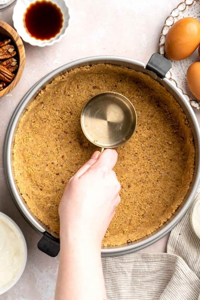 Rich and creamy Turtle Cheesecake with caramel, chocolate, and pecans is a decadent baked dessert with a buttery graham crust and silky filling. | aheadofthyme.com