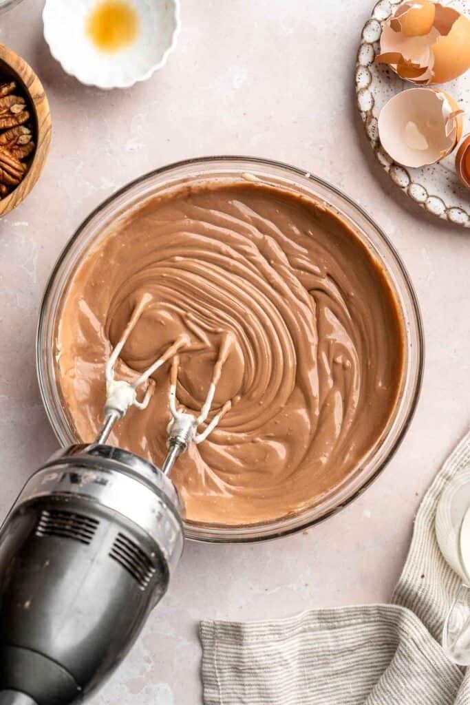 Rich and creamy Turtle Cheesecake with caramel, chocolate, and pecans is a decadent baked dessert with a buttery graham crust and silky filling. | aheadofthyme.com