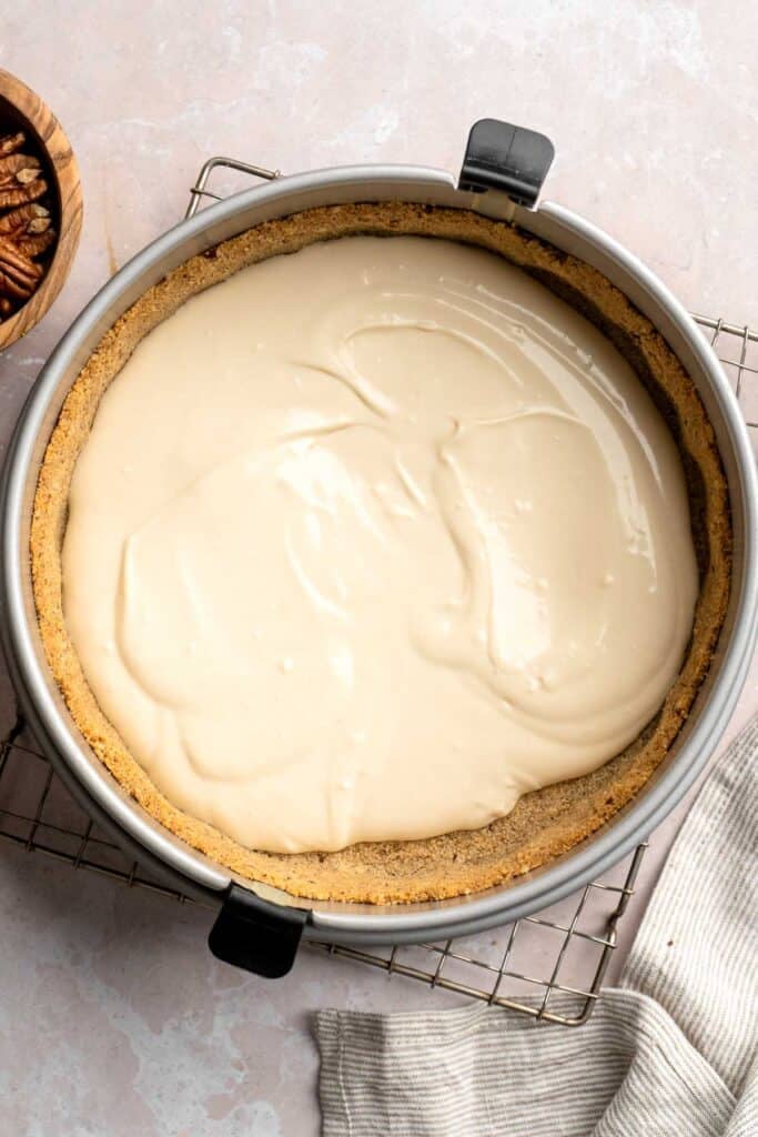 Rich and creamy Turtle Cheesecake with caramel, chocolate, and pecans is a decadent baked dessert with a buttery graham crust and silky filling. | aheadofthyme.com