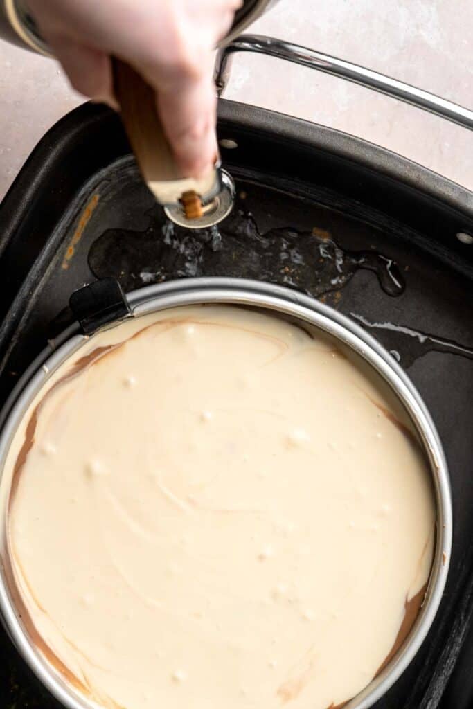 Rich and creamy Turtle Cheesecake with caramel, chocolate, and pecans is a decadent baked dessert with a buttery graham crust and silky filling. | aheadofthyme.com