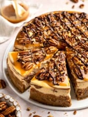 Rich and creamy Turtle Cheesecake with caramel, chocolate, and pecans is a decadent baked dessert with a buttery graham crust and silky filling. | aheadofthyme.com