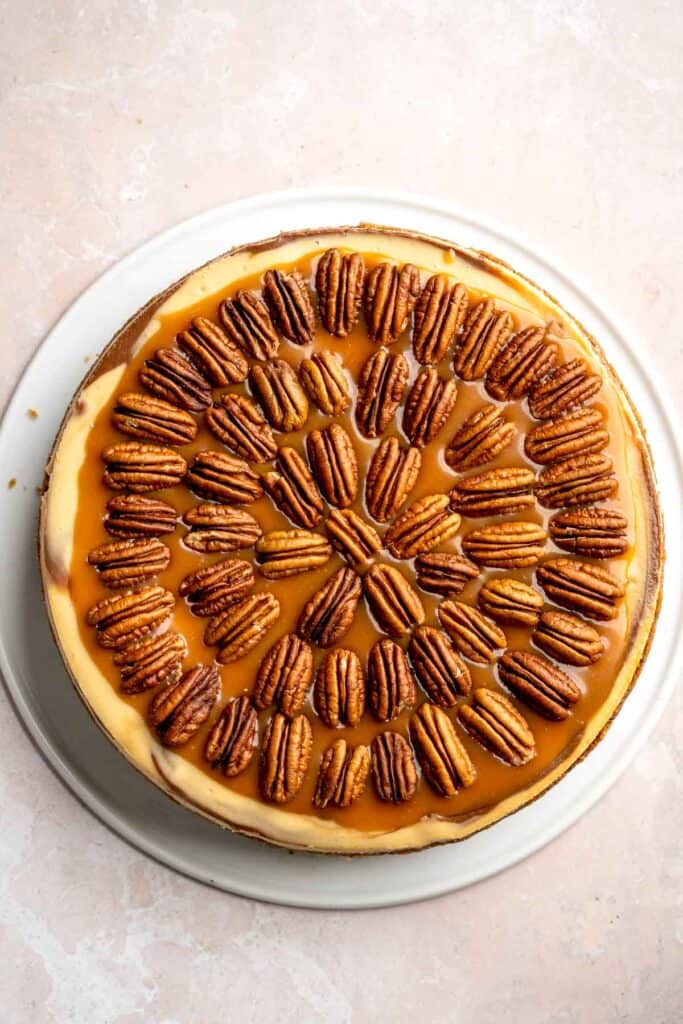 Rich and creamy Turtle Cheesecake with caramel, chocolate, and pecans is a decadent baked dessert with a buttery graham crust and silky filling. | aheadofthyme.com
