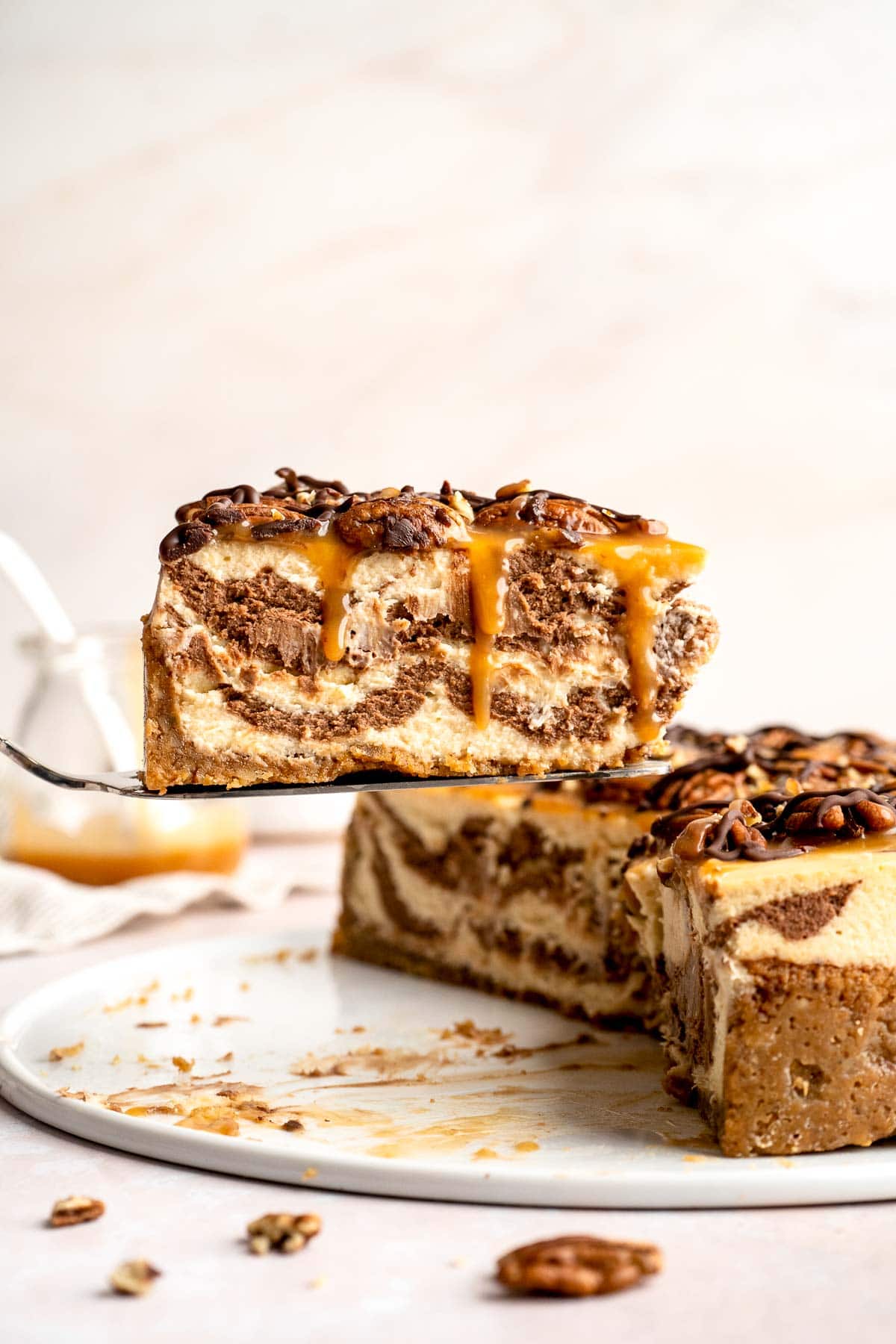 Rich and creamy Turtle Cheesecake with caramel, chocolate, and pecans is a decadent baked dessert with a buttery graham crust and silky filling. | aheadofthyme.com