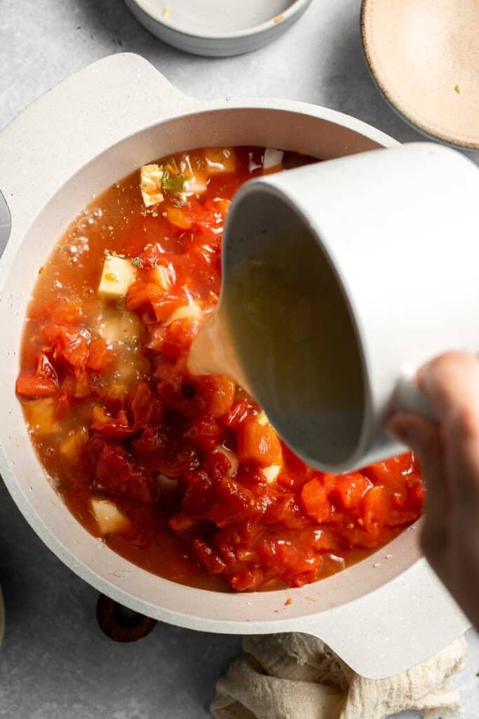 Warm up with this hearty and healthy vegetable cabbage soup packed with potatoes and carrots. A cozy one-pot meal ready in 30 minutes. | aheadofthyme.com