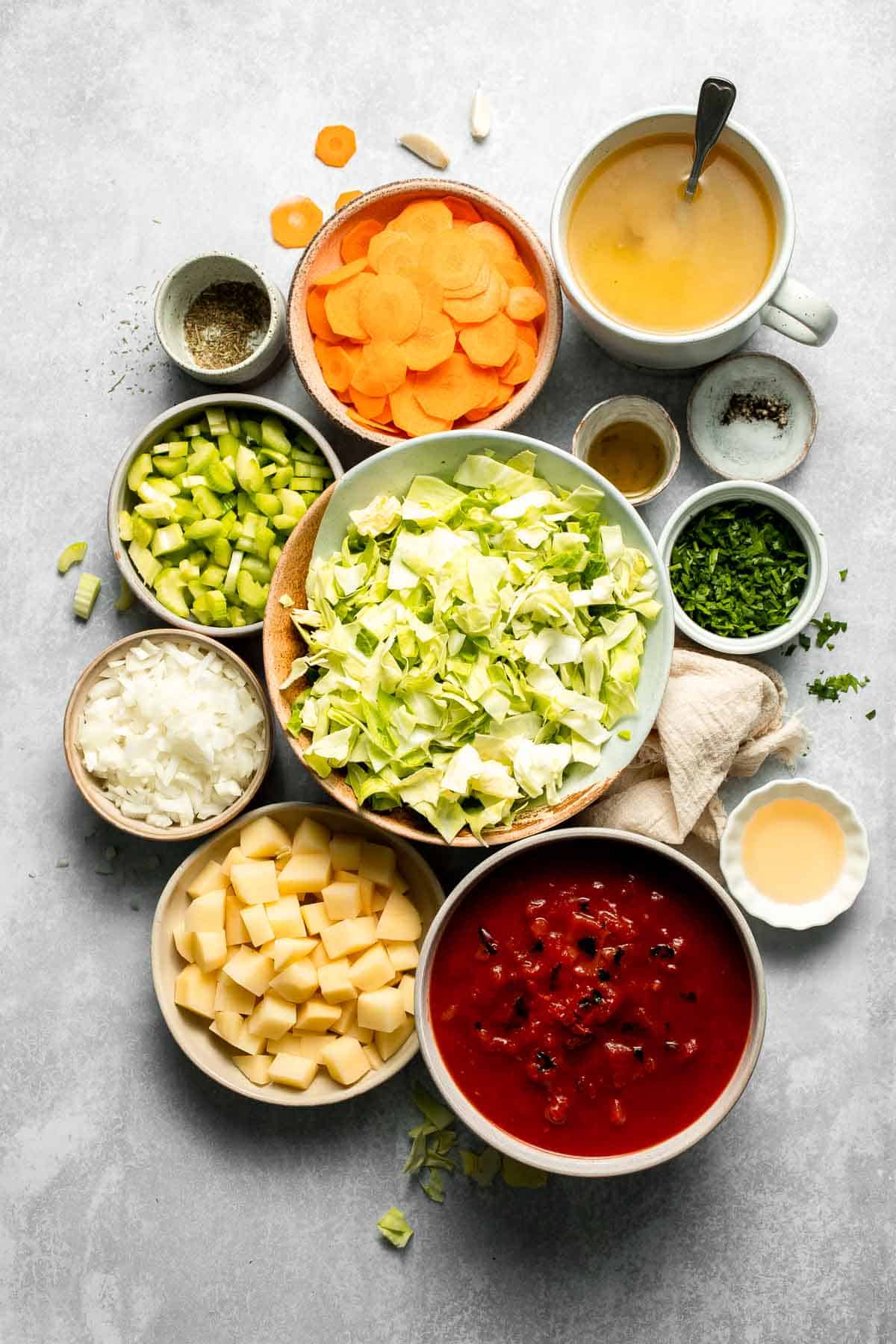 Warm up with this hearty and healthy vegetable cabbage soup packed with potatoes and carrots. A cozy one-pot meal ready in 30 minutes. | aheadofthyme.com