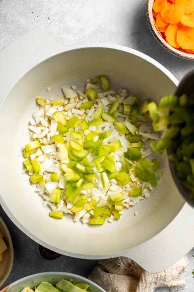 Warm up with this hearty and healthy vegetable cabbage soup packed with potatoes and carrots. A cozy one-pot meal ready in 30 minutes. | aheadofthyme.com