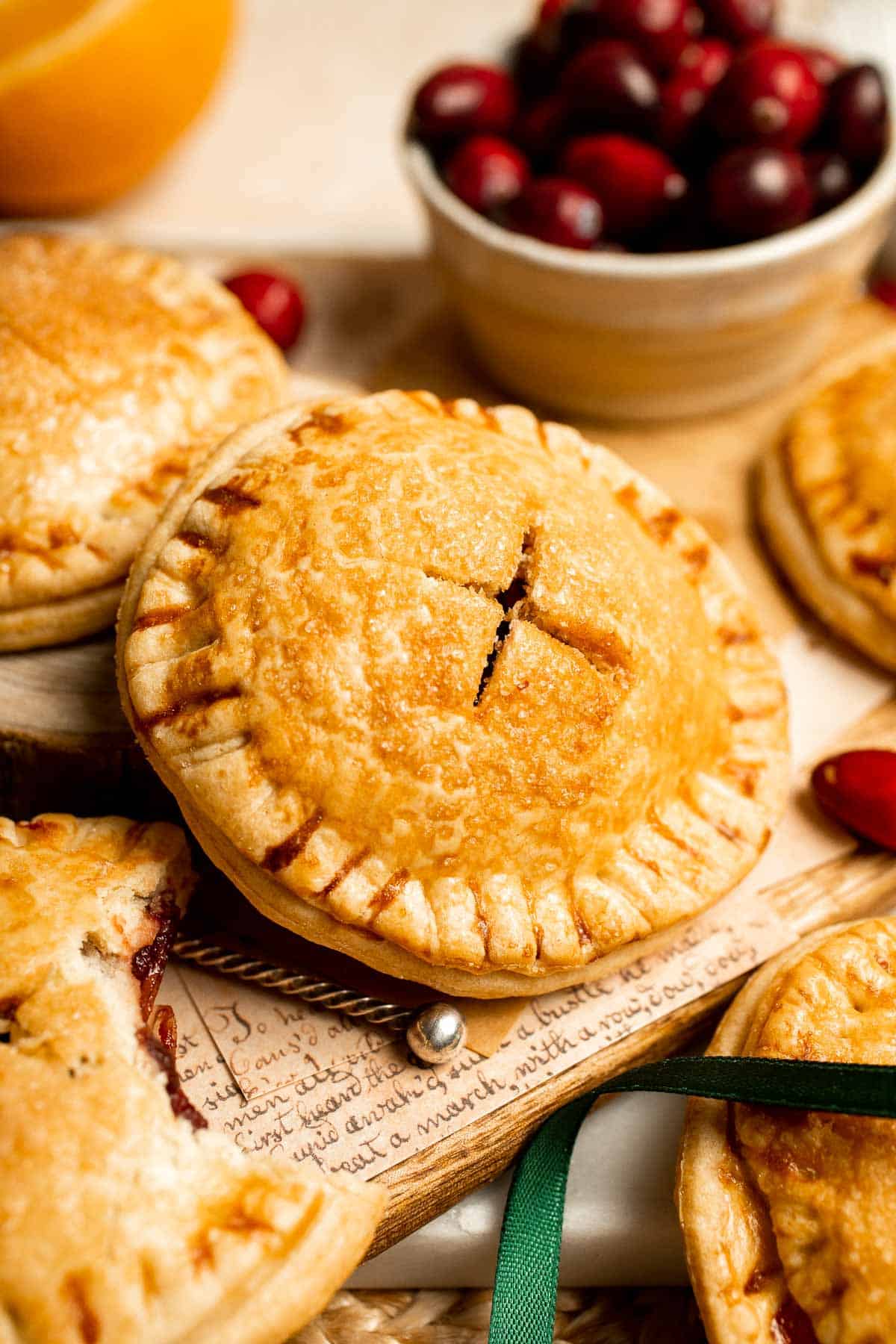 Cranberry Hand Pies are buttery, flaky, and filled with leftover cranberry sauce. An easy, festive holiday dessert perfect for Thanksgiving or Christmas. | aheadofthyme.com