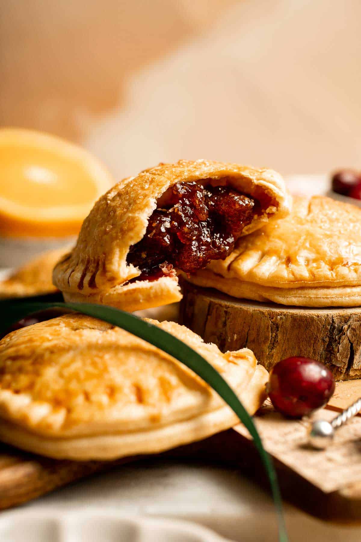 Cranberry Hand Pies are buttery, flaky, and filled with leftover cranberry sauce. An easy, festive holiday dessert perfect for Thanksgiving or Christmas. | aheadofthyme.com