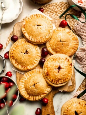 Cranberry Hand Pies are buttery, flaky, and filled with leftover cranberry sauce. An easy, festive holiday dessert perfect for Thanksgiving or Christmas. | aheadofthyme.com