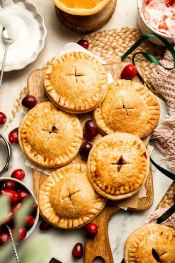 Cranberry Hand Pies are buttery, flaky, and filled with leftover cranberry sauce. An easy, festive holiday dessert perfect for Thanksgiving or Christmas. | aheadofthyme.com