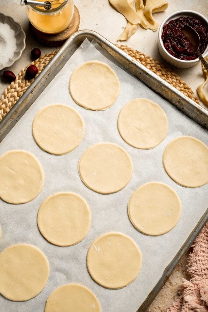 Cranberry Hand Pies are buttery, flaky, and filled with leftover cranberry sauce. An easy, festive holiday dessert perfect for Thanksgiving or Christmas. | aheadofthyme.com