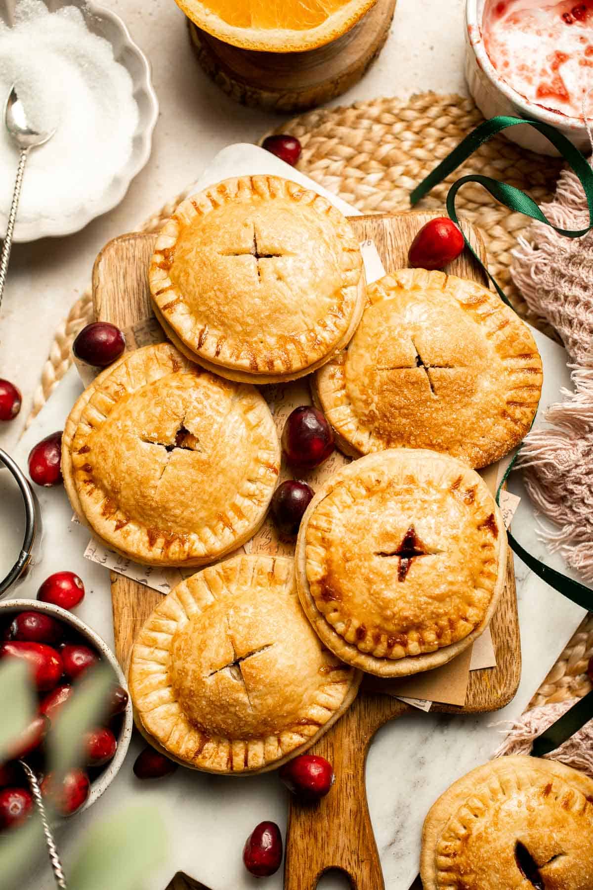 Cranberry Hand Pies are buttery, flaky, and filled with leftover cranberry sauce. An easy, festive holiday dessert perfect for Thanksgiving or Christmas. | aheadofthyme.com