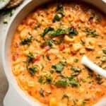 Creamy Tortellini Minestrone Soup is hearty, cozy, and loaded with veggies, beans, and cheese tortellini in a rich tomato-cream broth. | aheadofthyme.com