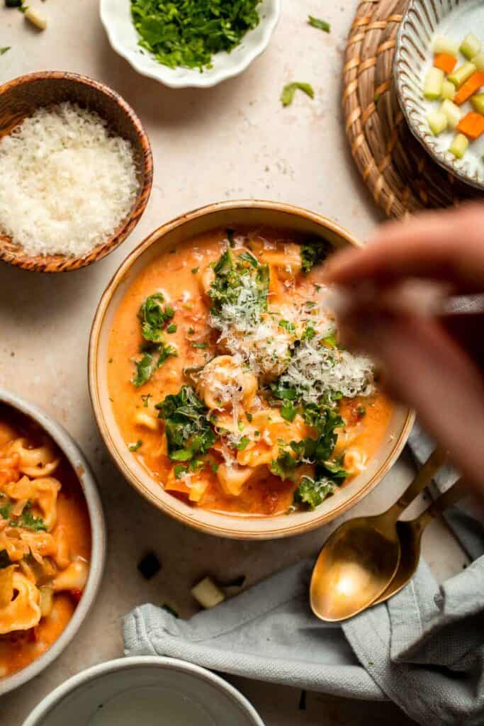 Creamy Tortellini Minestrone Soup is hearty, cozy, and loaded with veggies, beans, and cheese tortellini in a rich tomato-cream broth. | aheadofthyme.com