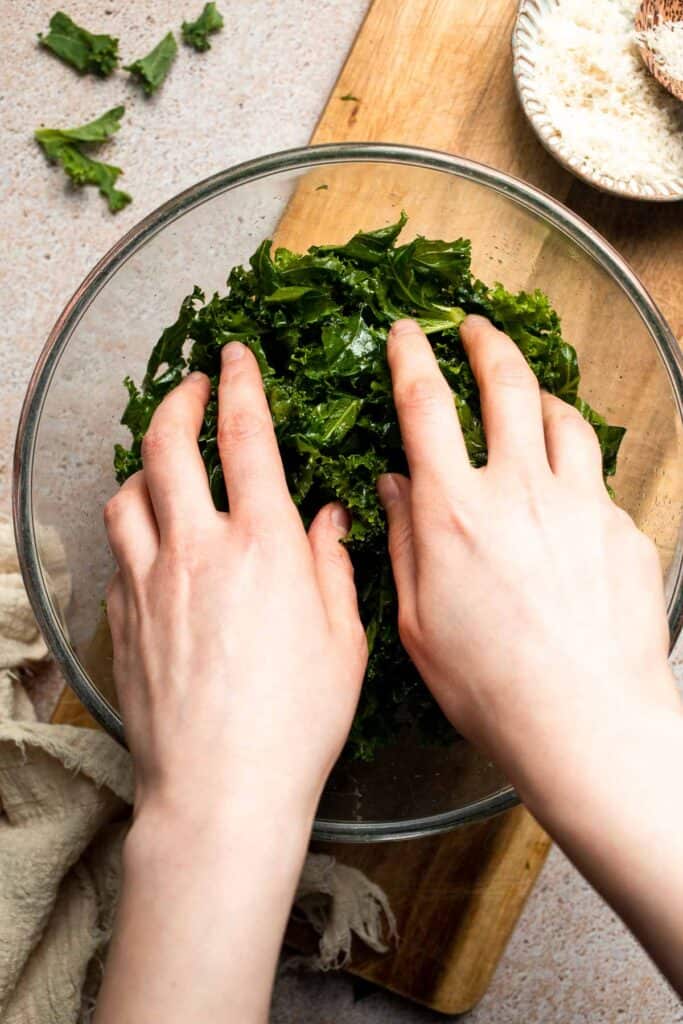 Crispy roasted kale made with olive oil, garlic, and parmesan. A quick and healthy side dish that bakes into perfectly crunchy, flavorful pieces. | aheadofthyme.com