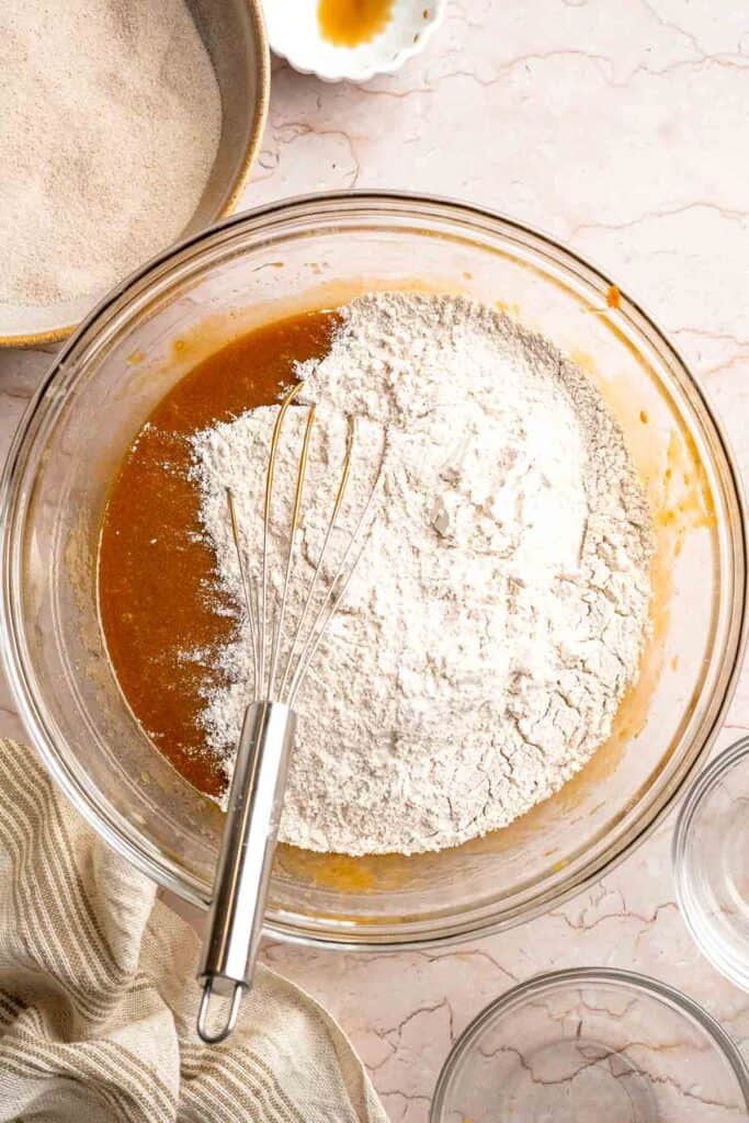 Soft and chewy gingerdoodle cookies, also known as ginger snickerdoodles, rolled in cinnamon ginger sugar with warm spices and molasses. | aheadofthyme.com