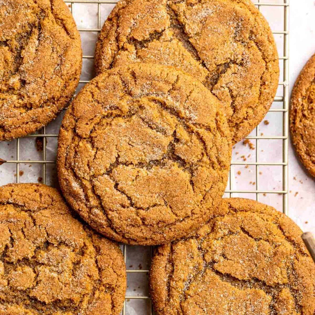 Soft and chewy gingerdoodle cookies, also known as ginger snickerdoodles, rolled in cinnamon ginger sugar with warm spices and molasses. | aheadofthyme.com
