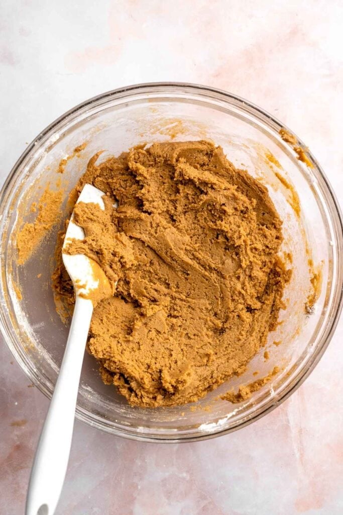 Soft and chewy gingerdoodle cookies, also known as ginger snickerdoodles, rolled in cinnamon ginger sugar with warm spices and molasses. | aheadofthyme.com