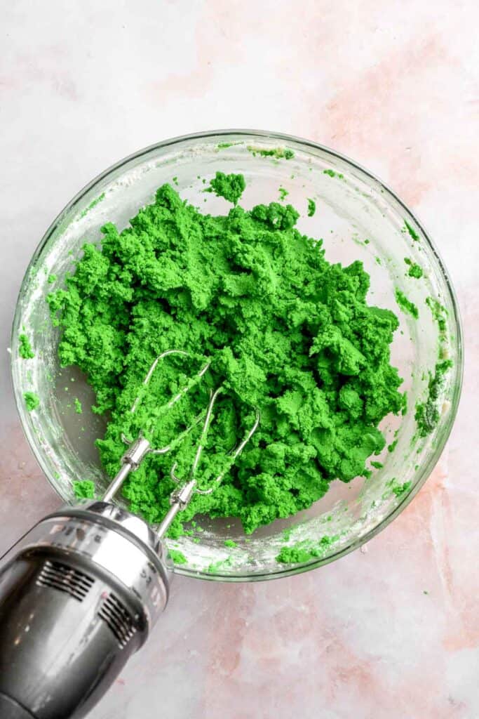 Grinch Cookies are soft, chewy green sugar cookies rolled in sparkly sugar and topped with a red heart. The cutest Christmas cookies for holiday baking. | aheadofthyme.com