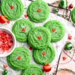 Grinch Cookies are soft, chewy green sugar cookies rolled in sparkly sugar and topped with a red heart. The cutest Christmas cookies for holiday baking. | aheadofthyme.com