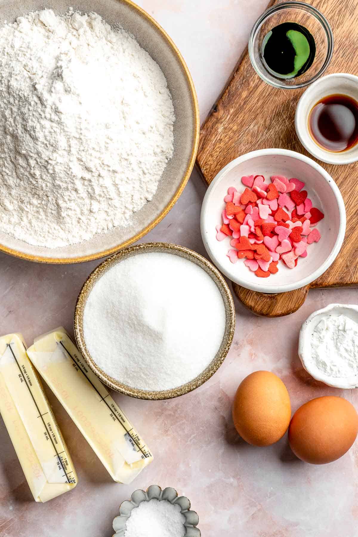 Grinch Cookies are soft, chewy green sugar cookies rolled in sparkly sugar and topped with a red heart. The cutest Christmas cookies for holiday baking. | aheadofthyme.com