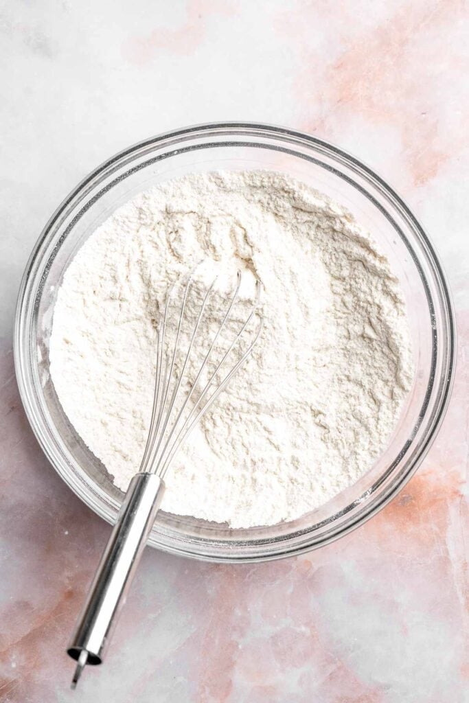 Grinch Cookies are soft, chewy green sugar cookies rolled in sparkly sugar and topped with a red heart. The cutest Christmas cookies for holiday baking. | aheadofthyme.com