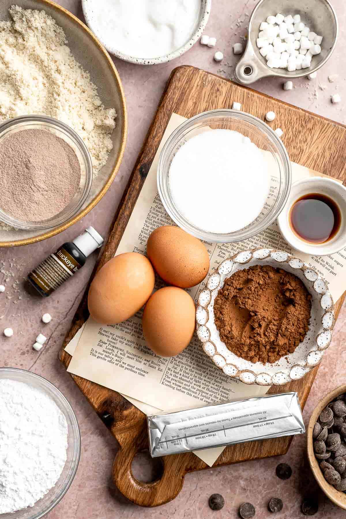 Hot chocolate macarons with cocoa shells and fluffy marshmallow filling. A cozy winter treat perfect for holiday baking and festive cookie trays. | aheadofthyme.com