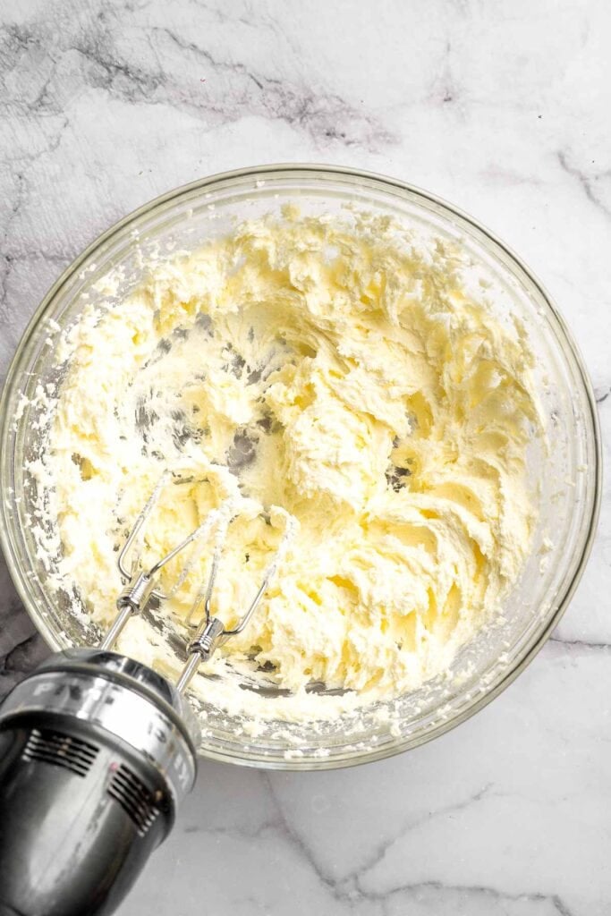 Peppermint pinwheel cookies with red, green, and white swirled dough rolled in festive sprinkles. A fun slice and bake Christmas cookie. | aheadofthyme.com