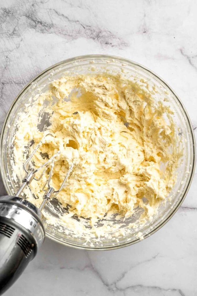 Peppermint pinwheel cookies with red, green, and white swirled dough rolled in festive sprinkles. A fun slice and bake Christmas cookie. | aheadofthyme.com