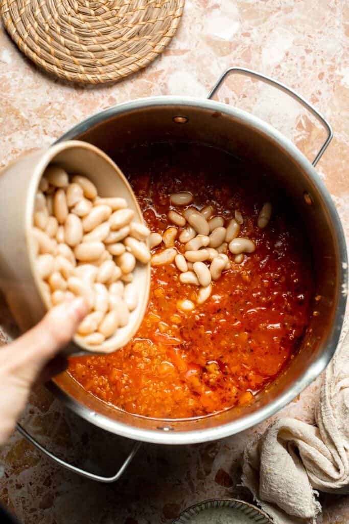 Hearty quinoa vegetable soup with tomatoes, beans, and kale. Healthy, cozy, and easy to make in one pot for a nourishing meal. | aheadofthyme.com